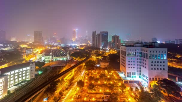 Hazy Kuala Lumpur night city light street view from the roof. HD time lapse. — Stock Video