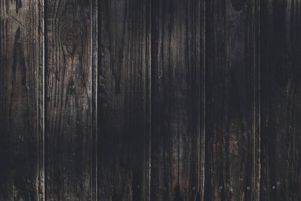 Background of an old, dark brown wall.