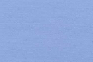 Açık mavi arkaplan ve açık pamuk kumaş dokusu.