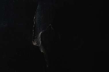 Eski, kırık bir karatahtanın siyah arka planı. Yumuşak odak.