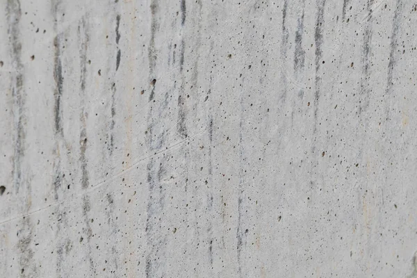 Açık gri arkaplan ve beton dokusu. Gri beton duvarın perspektif görüntüsü.