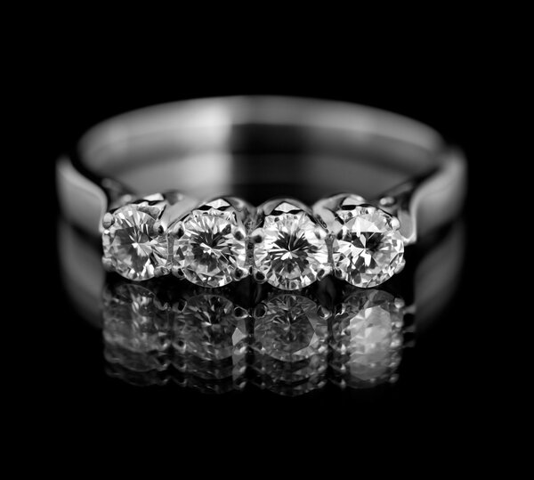 Jewellery diamond ring on a black background.