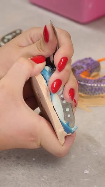 Female orthodontist hands take teeth model out of dental impression tray over desk in clinic closeup. Dentist works with cast for stomatologic prosthesis in laboratory vertical video Female orthodontist hands take teeth model out of dental impression tray over desk in clinic closeup. Dentist works with cast for stomatologic prosthesis in laboratory vertical video