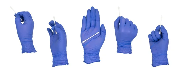 女人的手戴着蓝色的硝酸铵检查手套 拿着棉签摆着各种姿势 被白色的背景隔离了没有皮肤 图库图片