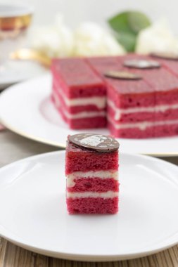 Delicious piece of cake with berry (raspberry) impregnation, close-up