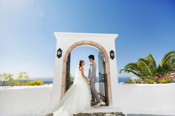 bride and groom look at each other