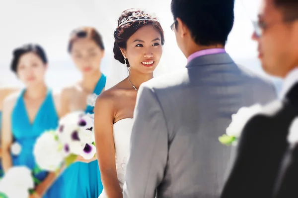 stylish rich smiling asian bride and groom