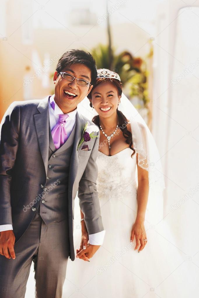 happy stylish asian bride and groom