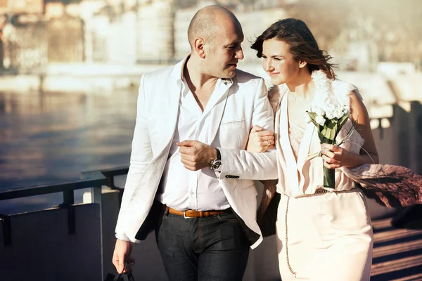 Happy stylish bride and groom walking — Stock Photo, Image