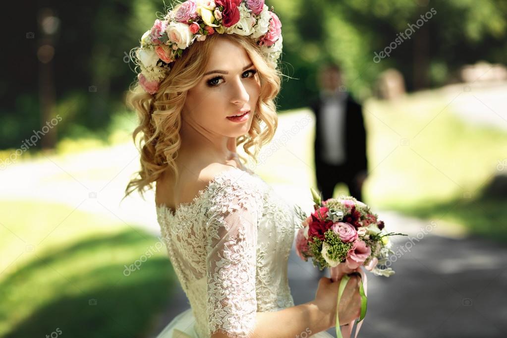 Gorgeous blonde smiling emotional bride