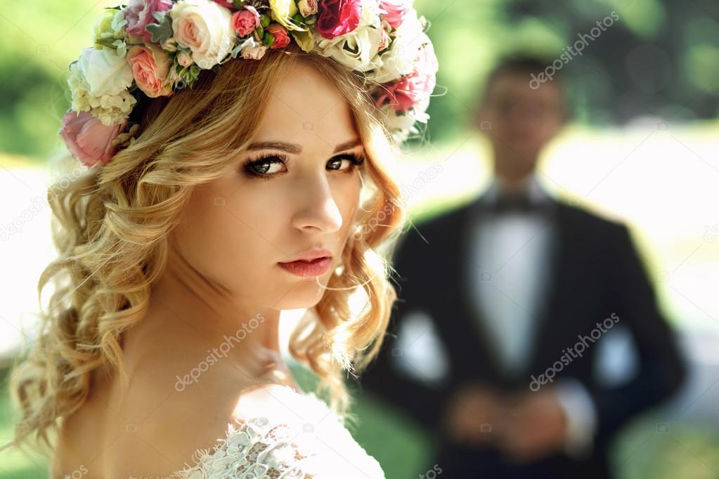 Gorgeous blonde smiling emotional bride