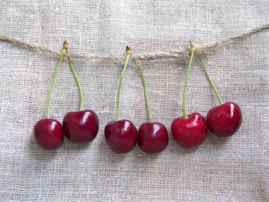 three pairs of ripe cherries