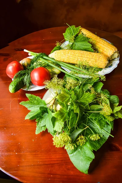 Tomatoes, cucumber, dill, garlic, pickles and corn. — Stock Photo, Image