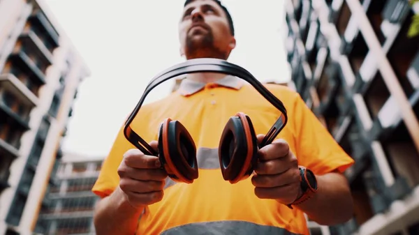 Builder Covers His Ears Ear Muff Protect Workers Ears Construction — Stock Photo, Image