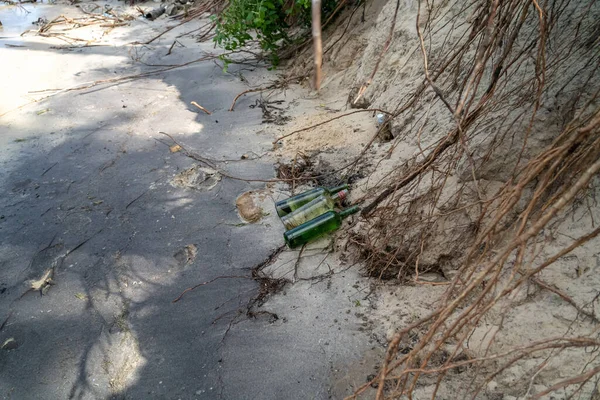 People and ecology. Riverside pollution. Trash and plastics at the beach. Human pollution of nature. Waste and plastic garbage on banks of dnieper river in Ukraine. Pollution of Kiev sea