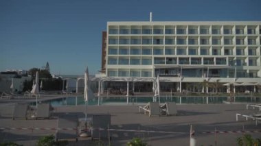 Problems tourist and hotel business in high season due to outbreak of covid-19 coronavirus infection. Hotel closed for quarantine. Concept quarantine and travel ban. Warning tape outside the hotel