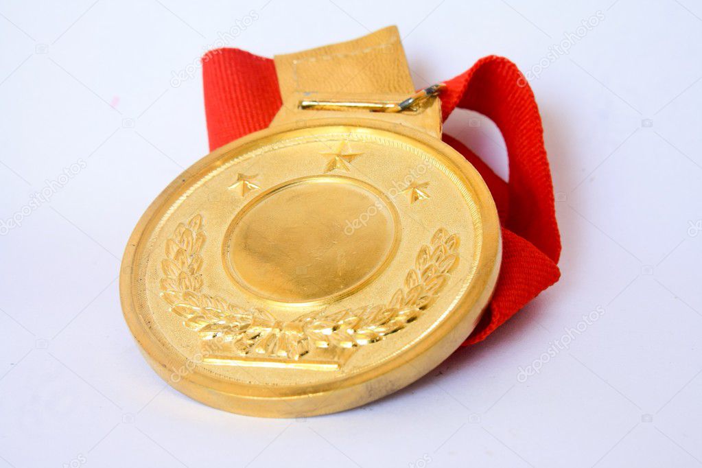 Golden medal isolated on white .