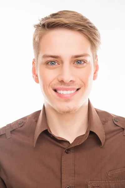 Close up portrait of young attractive smiling man in brown shirt — Stock Photo, Image