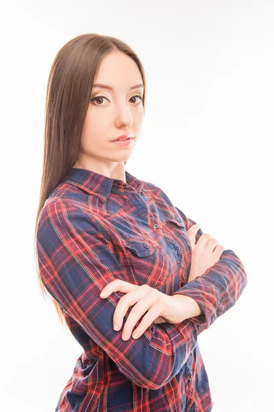 Porträt einer schönen, ernsthaften jungen Frau, die ihre Hände kreuzt — Stockfoto