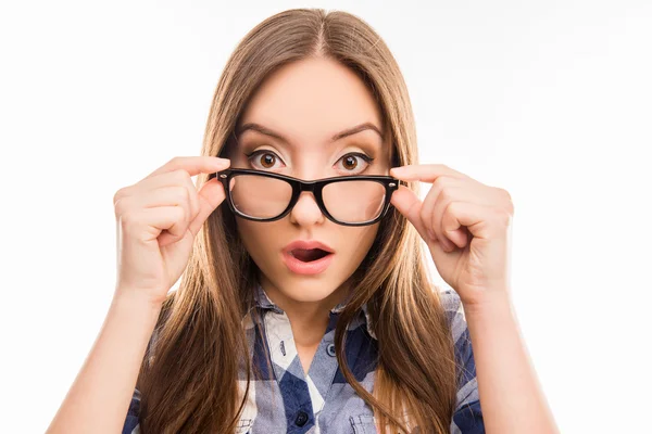 Surprised pretty  girl taking off her glasses, close up photo — Stockfoto