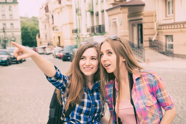 Two beautiful girlfriends walking on the tour — Stock Photo, Image