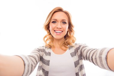 Pretty young woman making  selfie on white background clipart