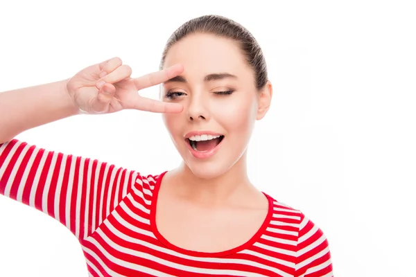 Cheerful girl gesturing with two fingers near eyes — Stock Photo, Image