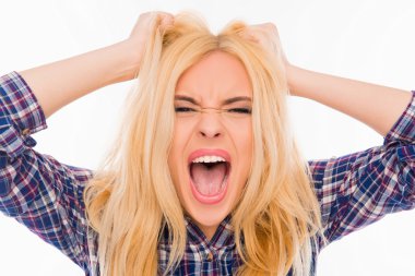 Close up portrait of angry woman screaming and holding head clipart