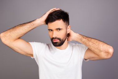 Portrait of young bearded man expertising his hair clipart