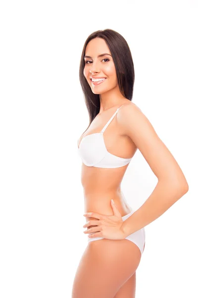 Boční pohled fotografie veselý usměvavý mladé ženy v bílém lingeri — Stock fotografie