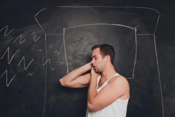 Young man against the background of chalkboard sleeping and snor — Stock Photo, Image