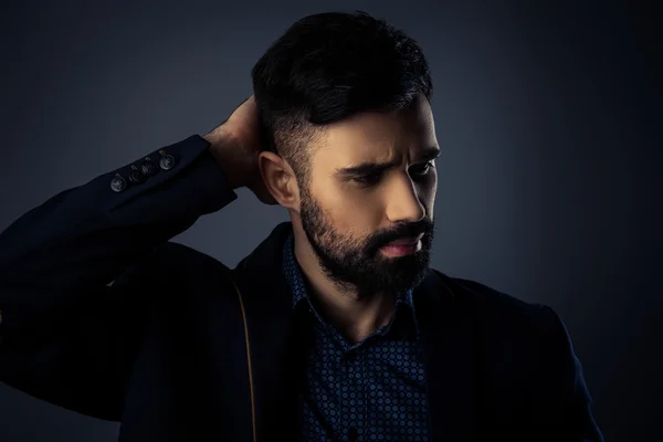 Close up portrait of brutal handsome man touching his hair — Stock Photo, Image