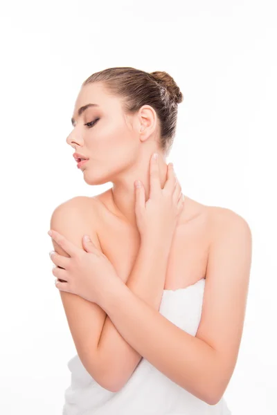 Portrait of sensitive woman in towel touching her body after sho — Stock Photo, Image