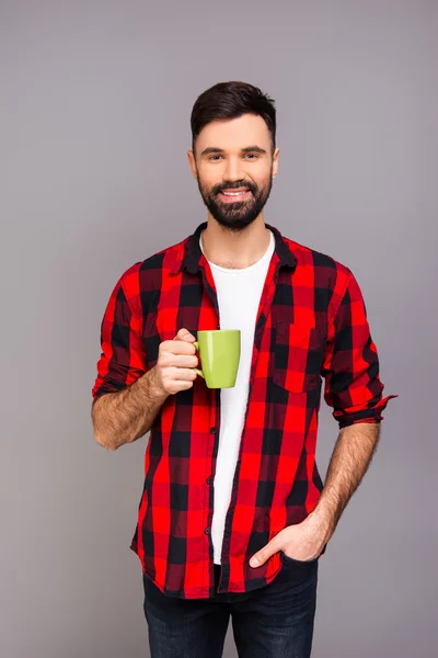 Happy bearded man having break and drinking tea — Stock Photo, Image