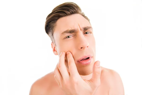 Close up photo of young attractive man expertising his face — Stock Photo, Image