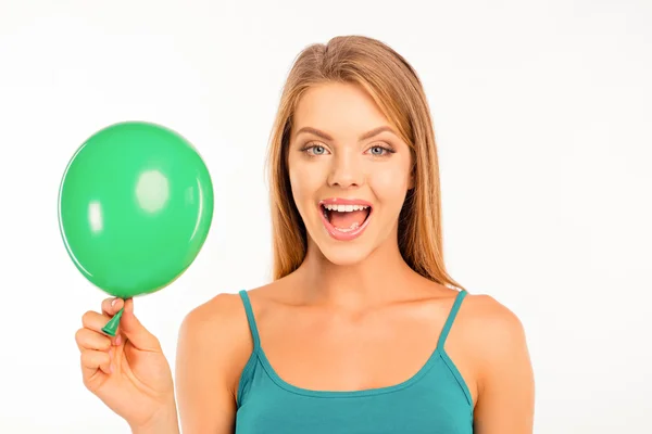 Happy cute girl with green balloon smiling — Stock Photo, Image