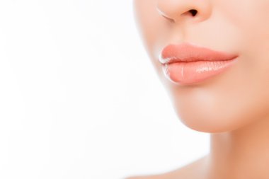 Close up photo of woman's lips with natural make up on white bac clipart