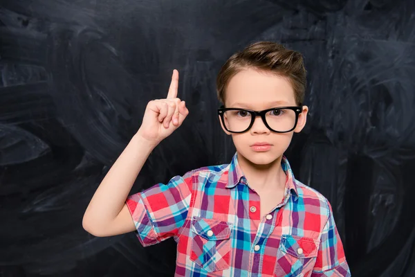 Portrait of little genious in glasses having great idea — Stock Photo, Image