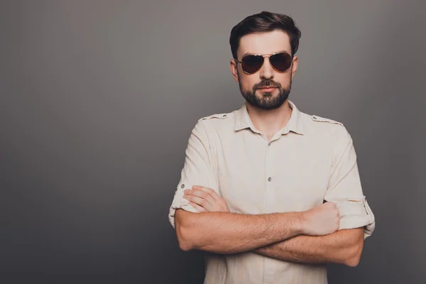 Brutal strict handsome man in glasses with crossed hands — Stock Photo, Image