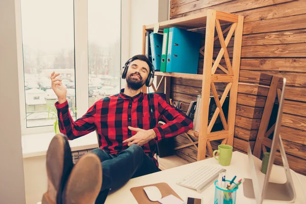 Happy man relaxing while listening music and gesturing like play — Stock Photo, Image