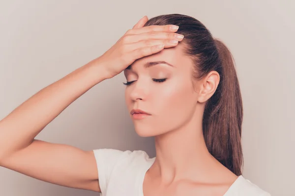 Portrait of overworked  sad young girl suffering from headache — Stock Photo, Image