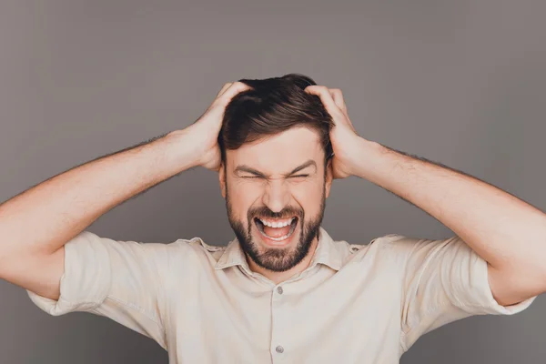 Young frustrated angry businessman with big problems screaming — Stock Photo, Image