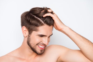 Portrait of smiling man showing his healthy hair without furfur clipart