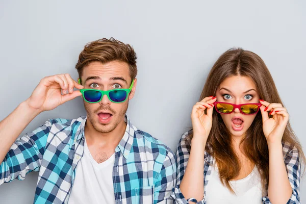 Wow! Surprised man and woman in glasses with open mouth