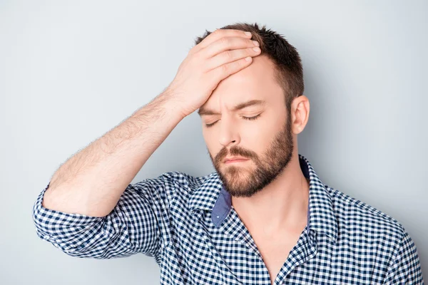 Portrait of tired sick young man with strong migraine — Stock Photo, Image