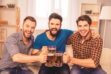 cheers! photo of handsome men celebrating victory and clinking g clipart