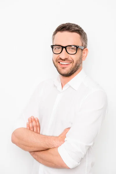 Portrait of successful happy man in glasses with crossed hands — Stock Photo, Image