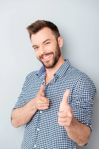 Cheerful happy smiling businessman gesturing and pointing on cam — Stock Photo, Image