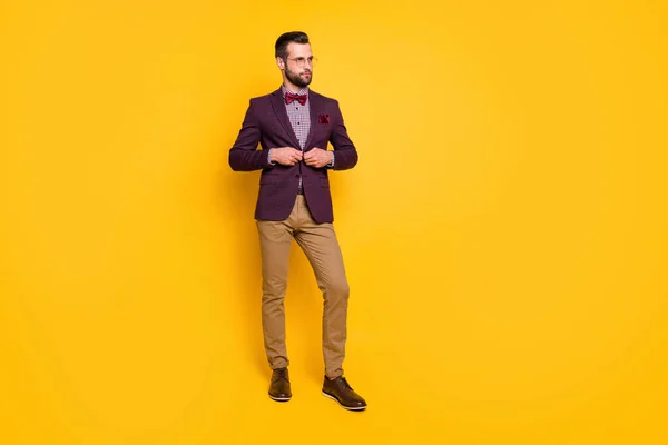 Full length body size view of his he nice attractive content fashionable guy boyfriend fastening button dressing isolated over bright vivid shine vibrant yellow color background — Stock Photo, Image