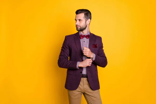 Portrait of his he nice attractive content fashionable guy fastening button preparing festal event isolated over bright vivid shine vibrant yellow color background — Stock Photo, Image